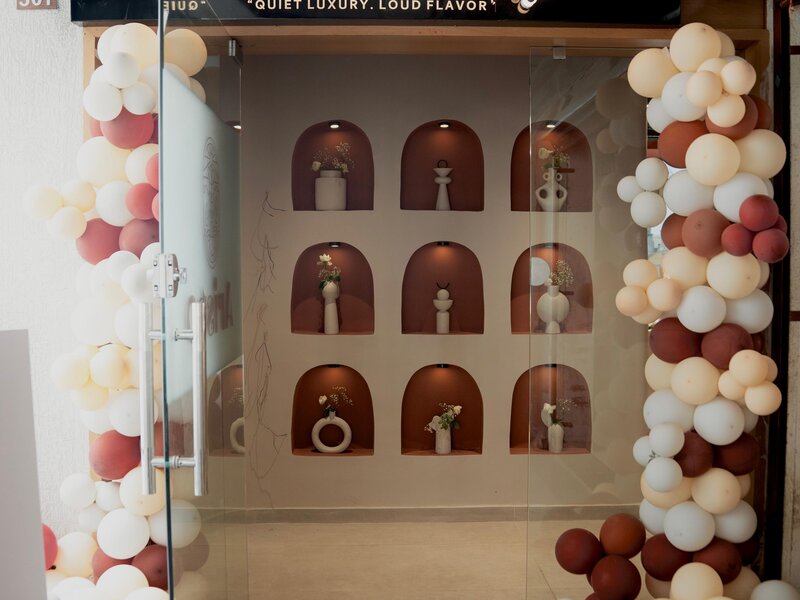 Elegant dining area at Aristo Cafe featuring premium furniture and warm ambiance in Bapunagar